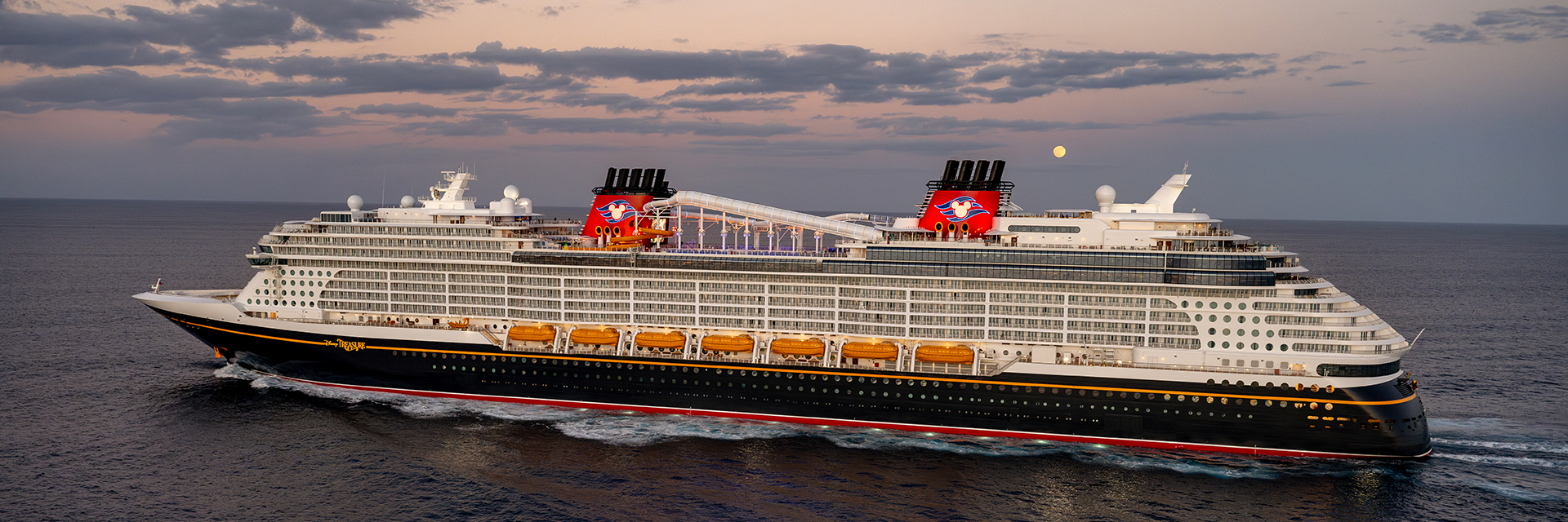 Large cruise ship sailing at dusk, with calm ocean waters and a moonlit sky.