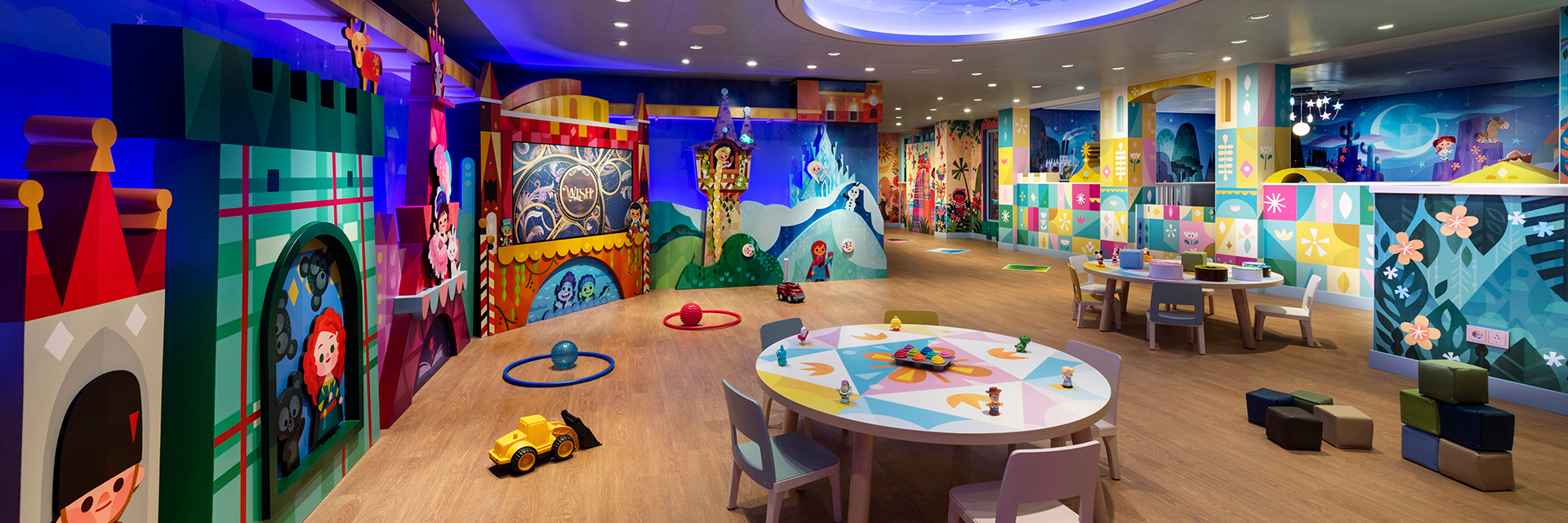 Colorful nursery play area with toys and themed walls on the Disney Wish cruise ship.